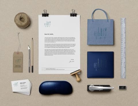 這張照片是一封信件，信封上有一個藍色的標誌，上面有幾個工具的圖案。