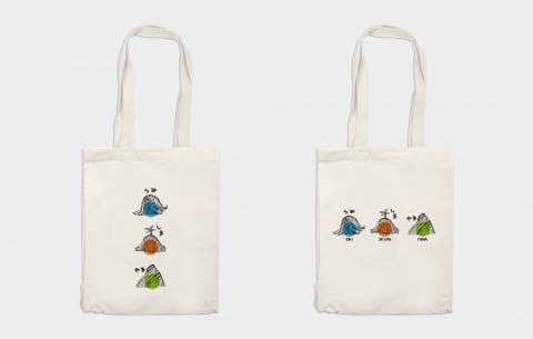 這張照片是兩張帆布袋，上面印有三個圖案，分別代表藍色、橘色和綠色。每個圖案下都有標註，分別是「藍」、「橘」和「綠」。