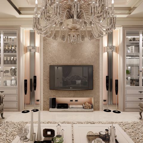 這張照片是一個現代化的客廳，最重要的是一個大型的電視，它懸掛在牆上，下方有一個黑色的電視櫃，上面放著音響設備。電視櫃的右側有一個用來放置木柴的架子，旁邊還有兩個大型的音響喇叭。