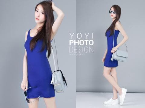 這張「兩個女孩穿著藍色連身裙，並手提不同風格手提包」的照片是，左邊的女孩留著長髮，右邊的女孩則戴著墨鏡。