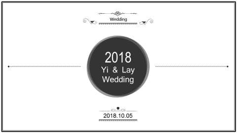 這張照片是一個婚禮邀請函，最重要的是中間的黑色圓形，上面寫著「2018 Yi & Lay Wedding」。