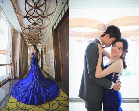 這張照片是一對新人在婚禮當天拍攝的婚紗照，畫面中的新郎新娘擁抱在一起，新郎穿著西裝，新娘穿著藍色婚紗，他們看起來非常甜蜜幸福。