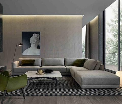 這張「現代客廳」的照片是一個灰色沙發、一張咖啡桌和一張綠色椅子。