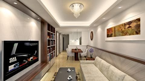 這張客廳的照片是一間明亮舒適的客廳，有沙發、電視和一個大型的書架，還有精美的裝飾畫。