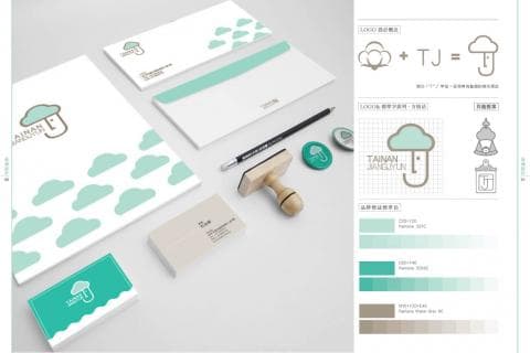 這張照片是設計師的品牌識別系統，包含商標、色彩和字型等元素。