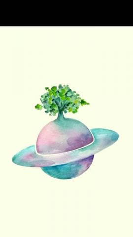 這張照片是一顆有綠色樹木的星球，它有環狀結構。