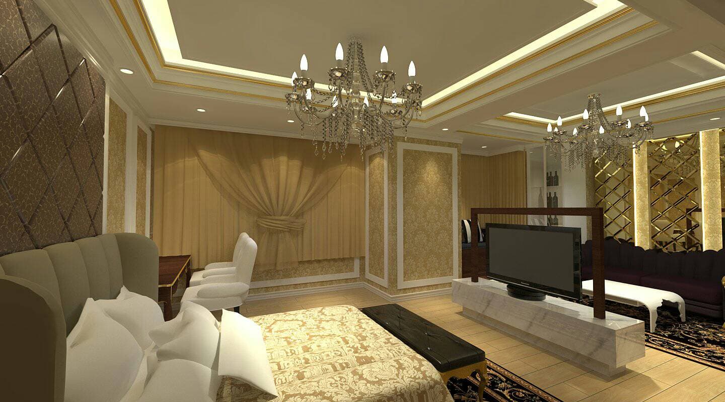 這張「臥室」的照片是一間豪華的臥室，床頭板上有金色的裝飾，床頭櫃上有臺燈，床邊還有一個床頭櫃，牆上掛著畫，房間裡還有一臺電視和一個壁爐。