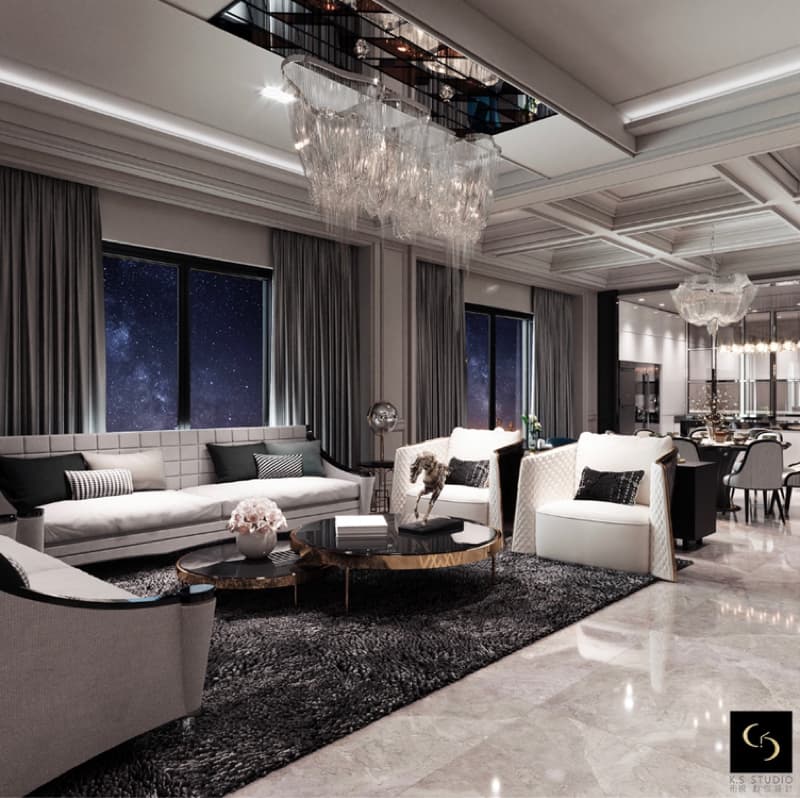 這張「客廳」的照片是一個現代化的客廳，有兩個沙發、一張咖啡桌、一張地毯和一個水晶燈。