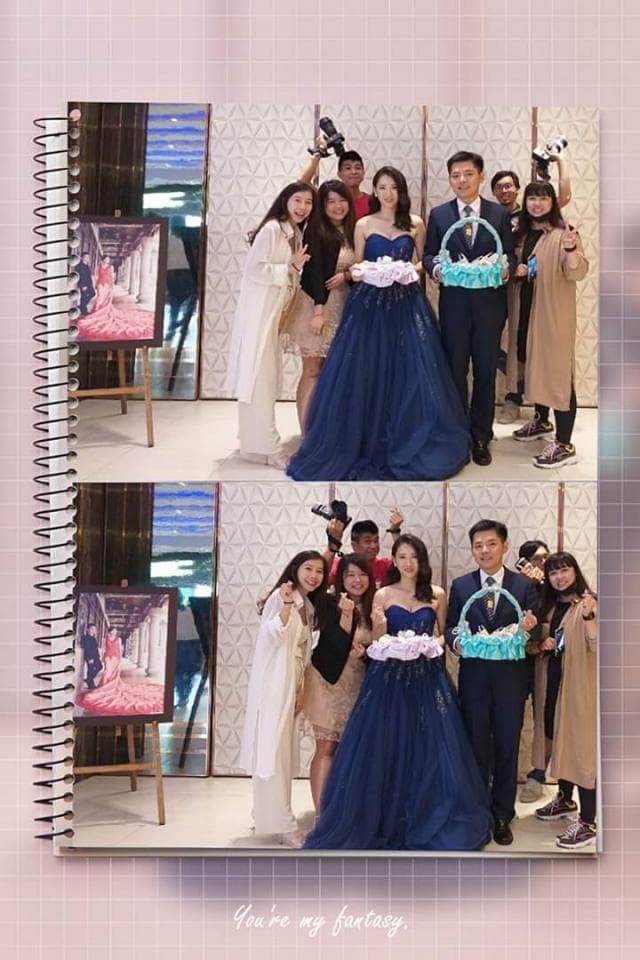 這張「婚禮」的照片是兩位新人和朋友們在婚禮現場合影,照片中兩位新人穿著婚紗和西裝,朋友們圍繞在新人身邊,場面溫馨喜慶。