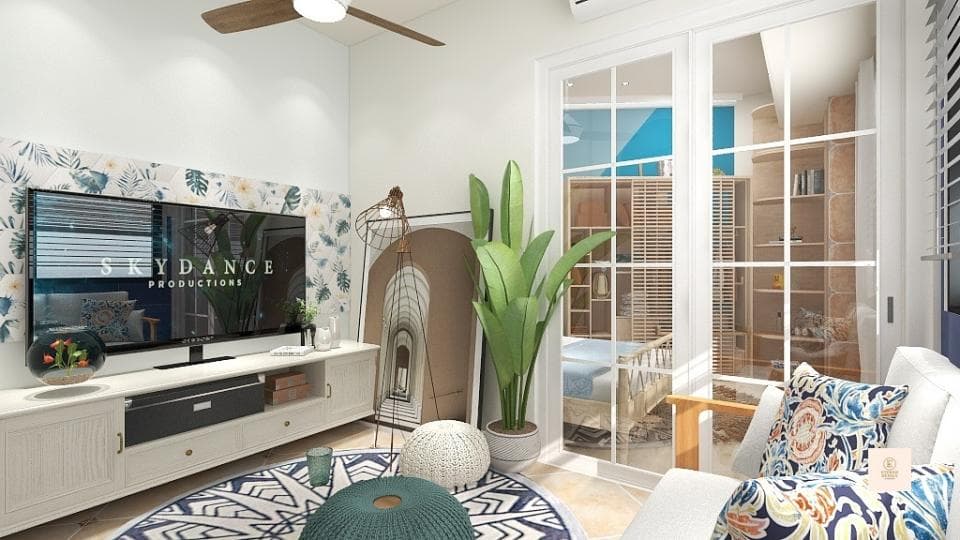 這張「客廳」的照片是一個舒適的空間,有電視、沙發、綠色植物和地毯。