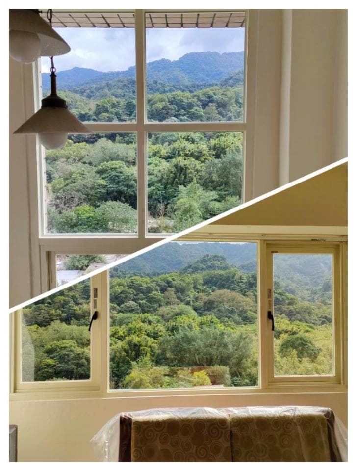 1) 照片顯示一個窗戶,窗戶上有兩盞燈,窗外可以看到綠色山丘