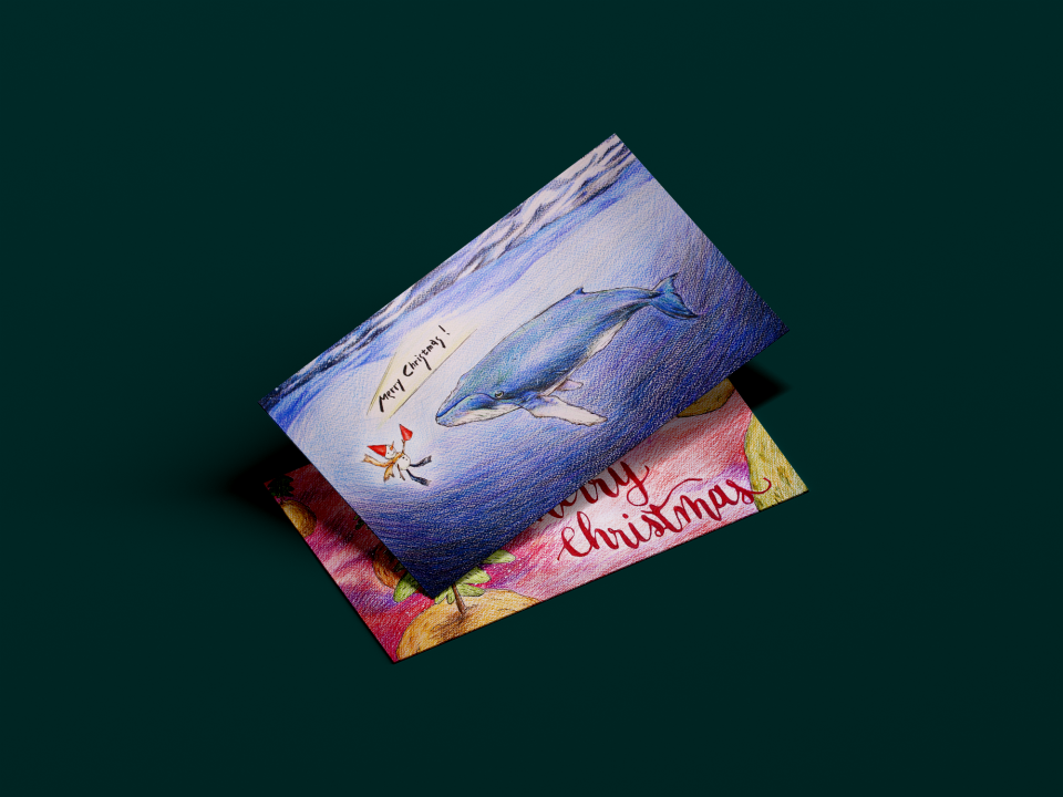 這張照片是一張聖誕賀卡,上面畫著一隻藍鯨在海裡遊,旁邊寫著「Merry Christmas」。