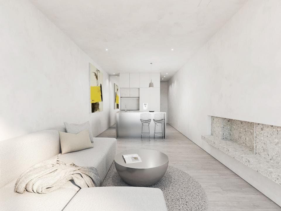 這張「現代化客廳」的照片是一個明亮寬敞的空間,有著白色的牆壁和地板,以及一個白色的沙發和一張圓形的咖啡桌。牆上掛著一幅抽象畫,牆壁一側有一個石頭砌成的壁爐。