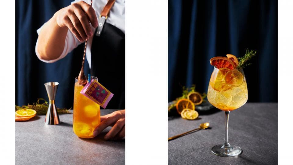 這張「調酒」的照片是兩杯不同的雞尾酒,一杯是橙色系的,另一杯是黃色系的,看起來都很美味。