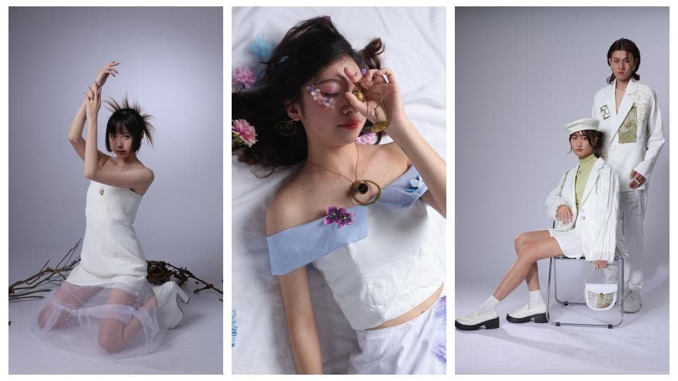 這張照片是三個女孩穿著白色系服裝的合照,她們各自展現出不同的風格,其中最重要的是中間那個女孩,她穿著一件白色蕾絲上衣,搭配一條藍色的薄紗裙,並戴著一個金色的項鍊,看起來非常優雅。