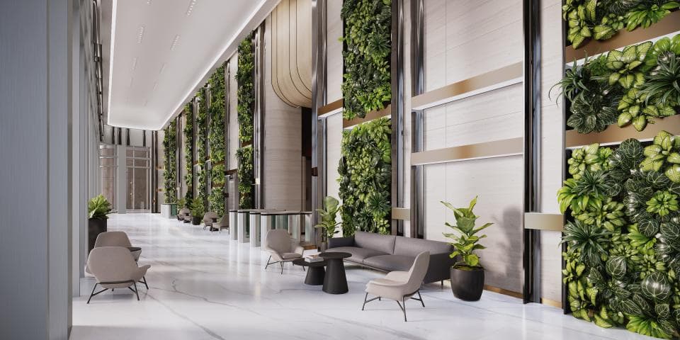 這張「現代化辦公大樓」的照片是展示一個寬敞的休息室,兩側有綠色植物牆,中間擺放著舒適的沙發和椅子。