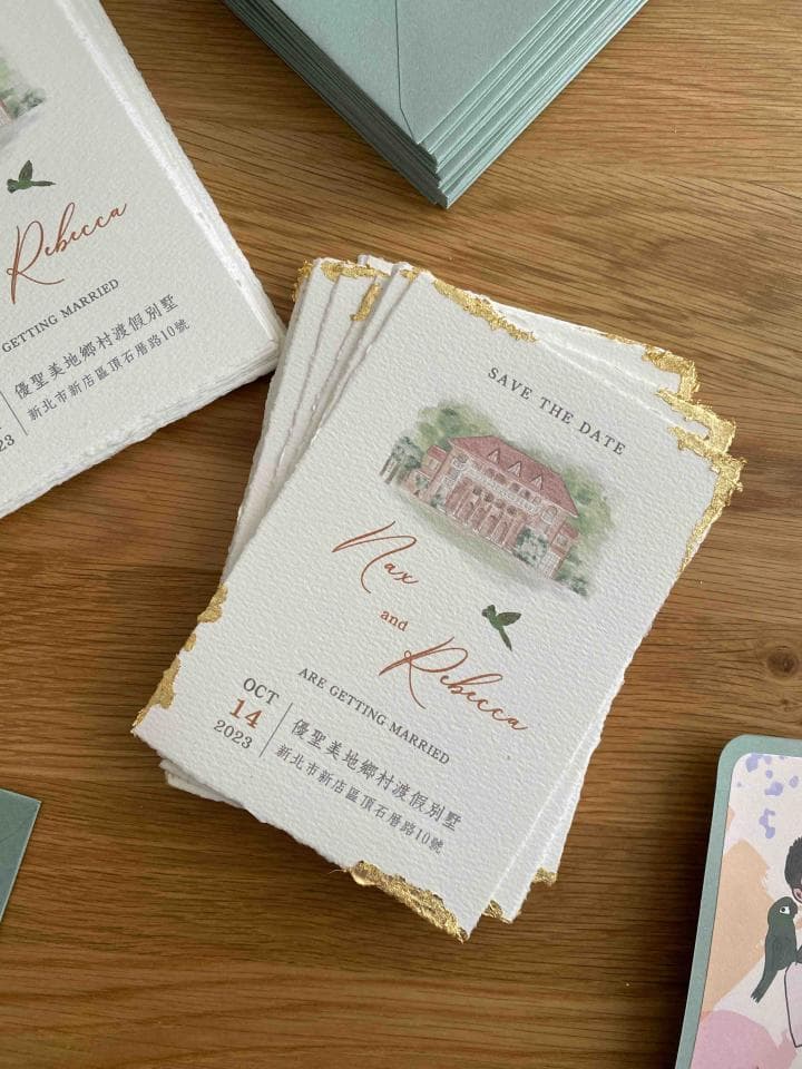 這張「婚禮喜帖」的照片是一張手工製作的喜帖,上面印著一對新人姓名「Max 和 Rebecca」,婚禮日期「10 月 14 日 2023 年」,還有他們的婚禮地點。