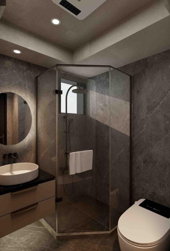 這張浴室的照片是一個現代化的浴室,帶有玻璃淋浴間、洗臉盆和馬桶。浴室的牆壁和地板都鋪著深色瓷磚,營造出簡約優雅的氛圍。
