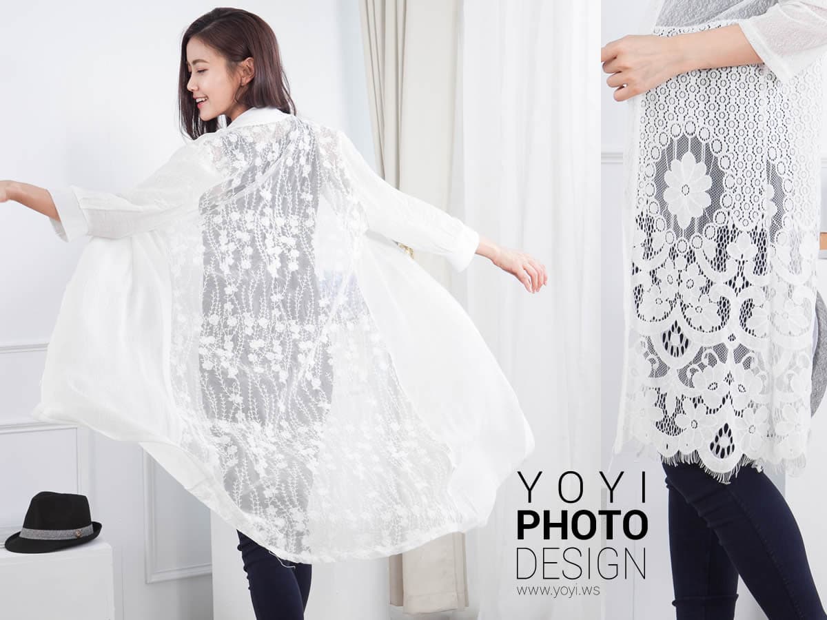 這張「蕾絲外套」的照片是一個女人穿著白色蕾絲外套,外套上有很多精緻的花紋,她看起來很優雅。